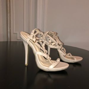 Strapped tanned and studded heels. Size 7